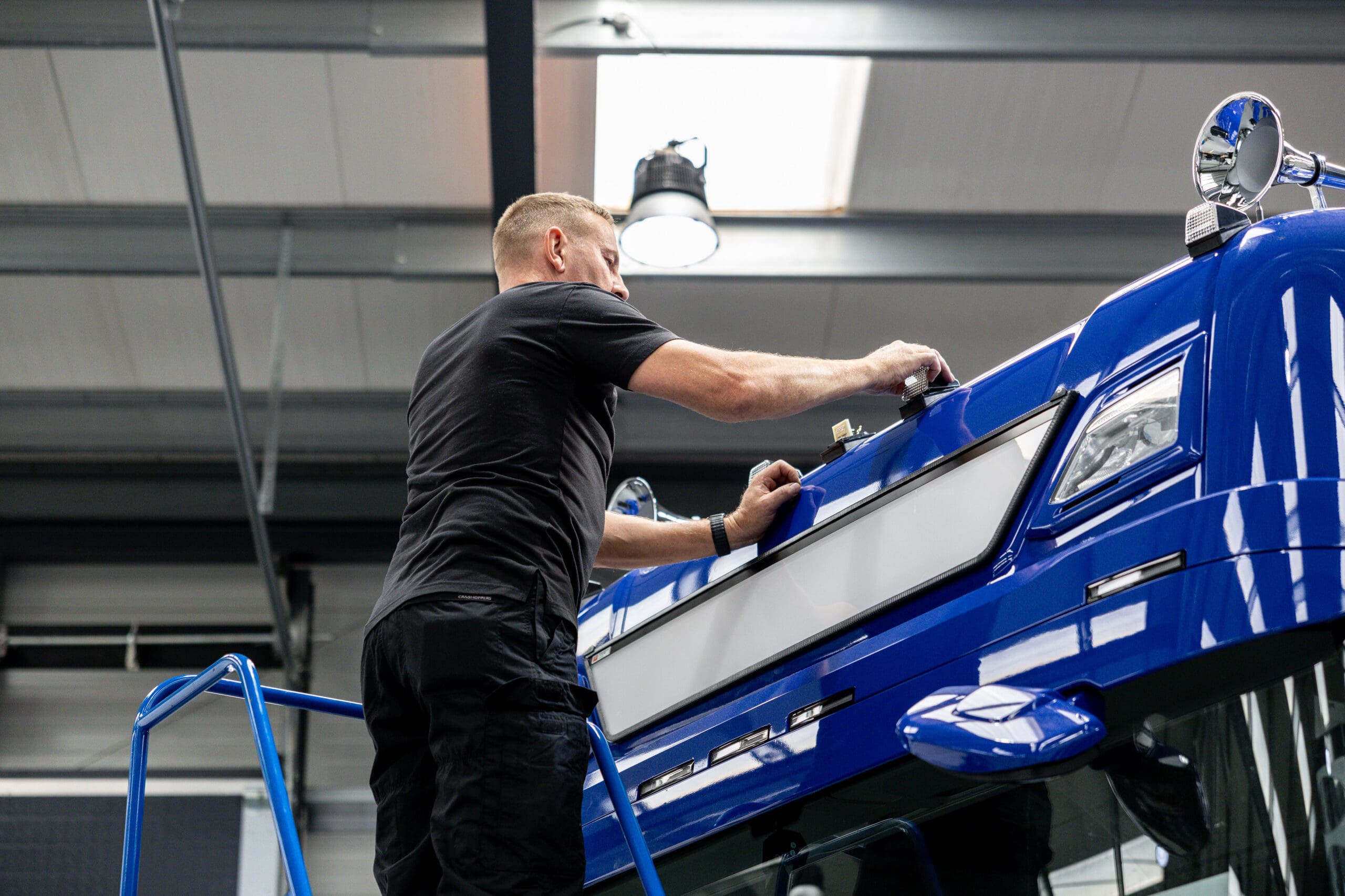 Smithbros member working on a blue truck