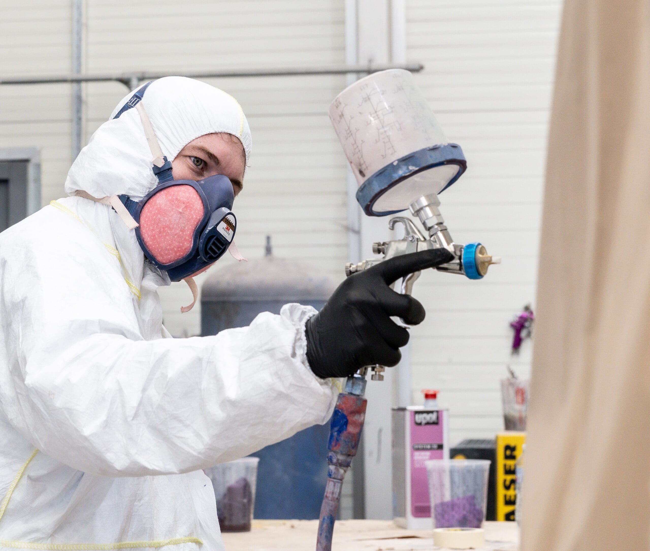 Smithbros worker painting a truck