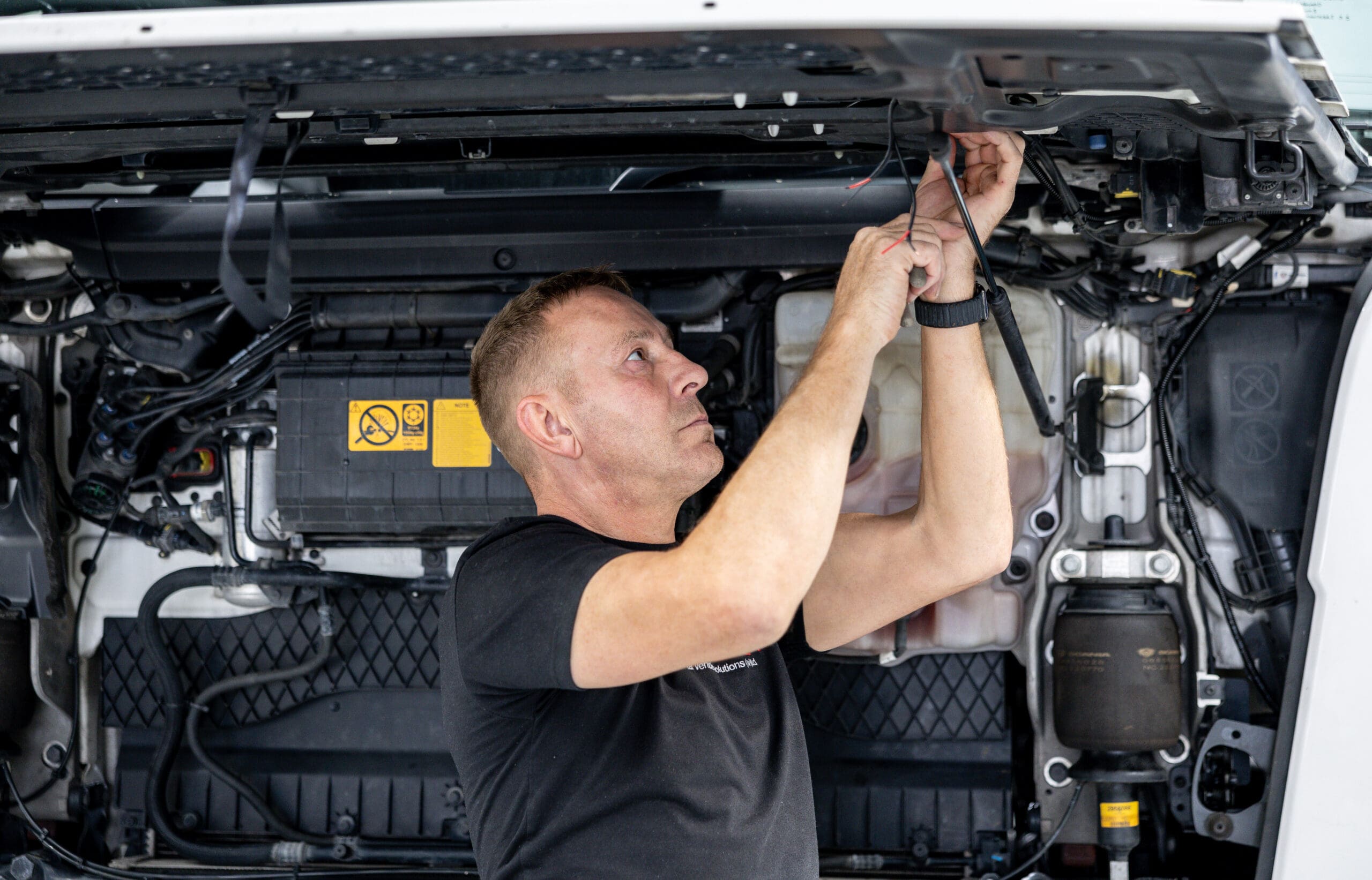 Smithbros mechanic working on truck